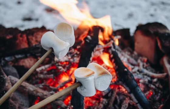 Roasting marshmallows over a fire. Winter fire safety tips.