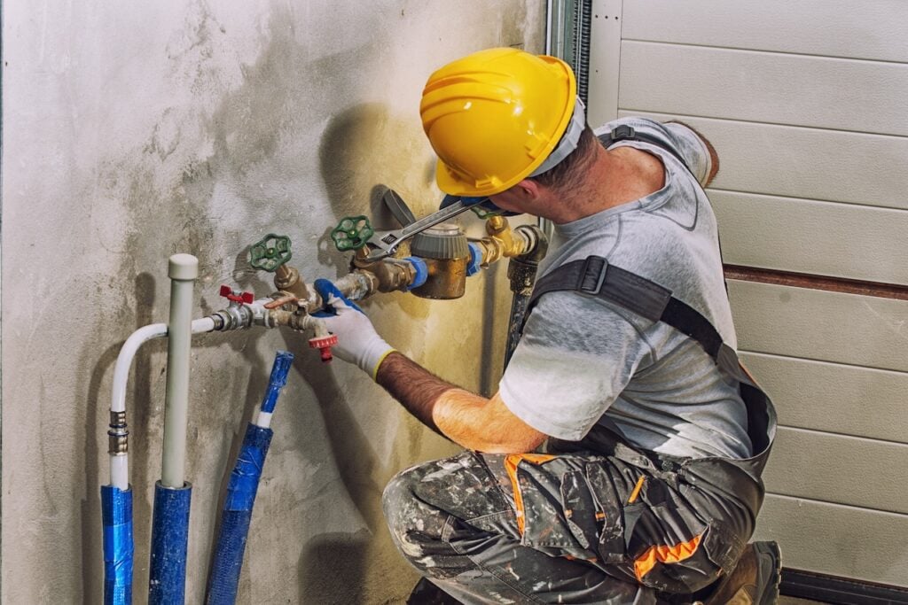 Professional fixing some sewage damaged pipes