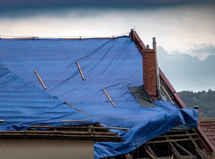 Knowing how to tarp a roof is important