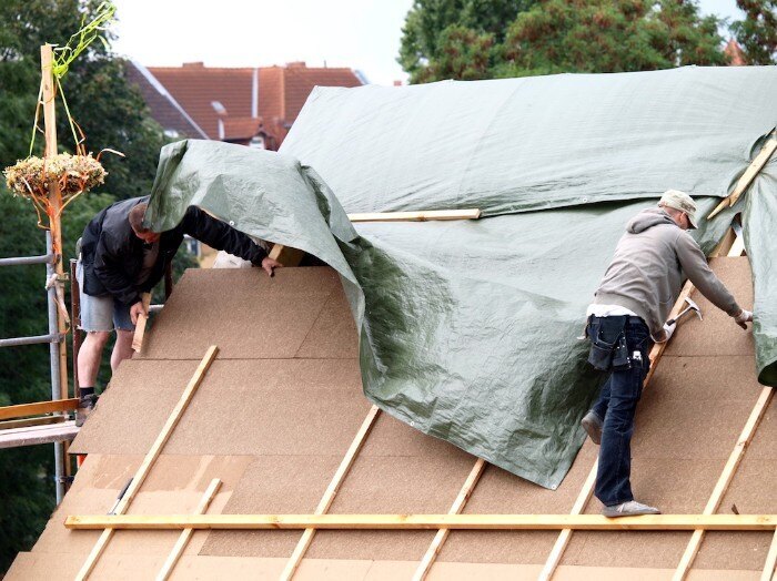 Knowing how to tarp a roof is important