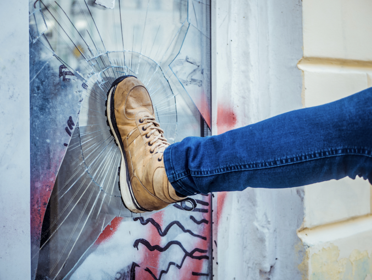 A building falling victim to vandalism and in need of vandalism cleanup.
