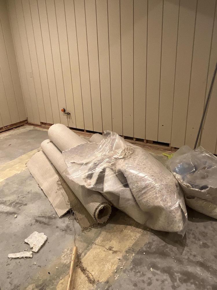 A basement affected by water loss. The carpet is being pulled up for rennovation.