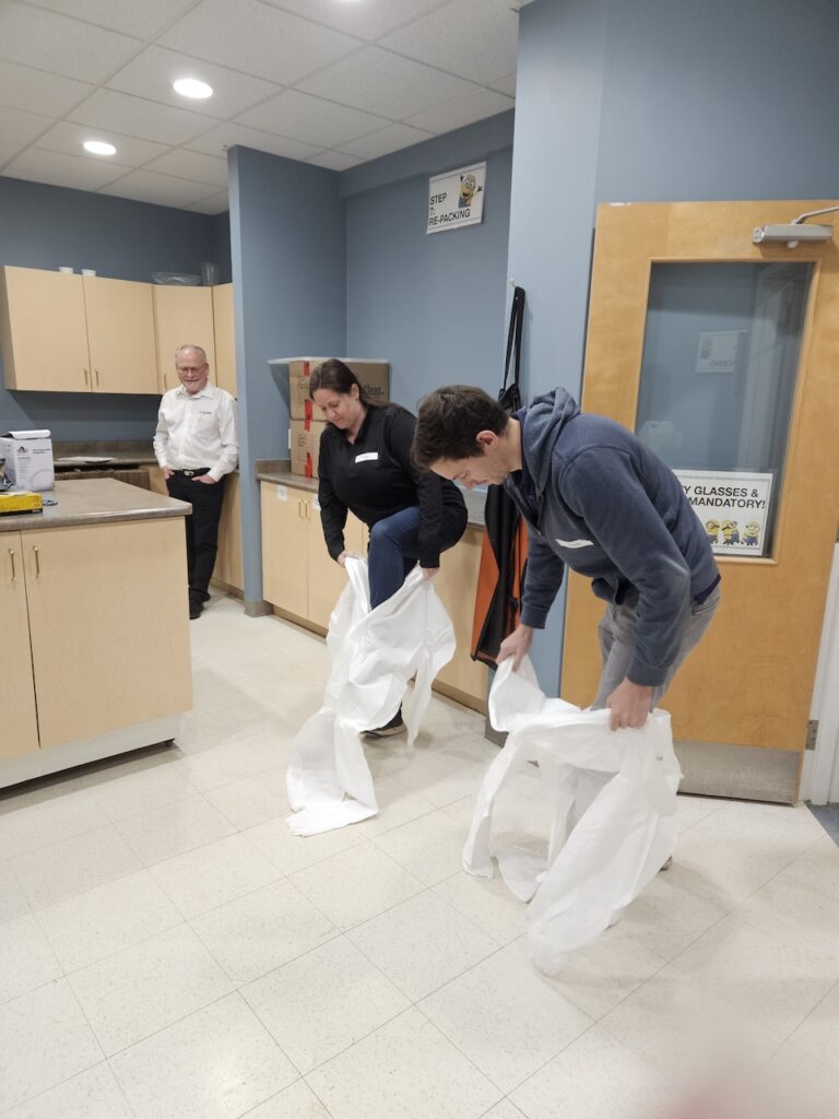 Class participants dressed in PPE gear and learned about donning and doffing PPE.