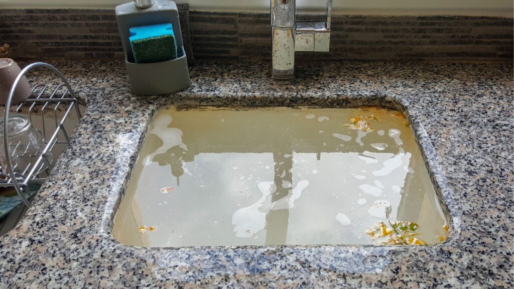 A slow-draining sink or bathtub could indicate that something is blocking the flow of wastewater, which could eventually lead to a backup.