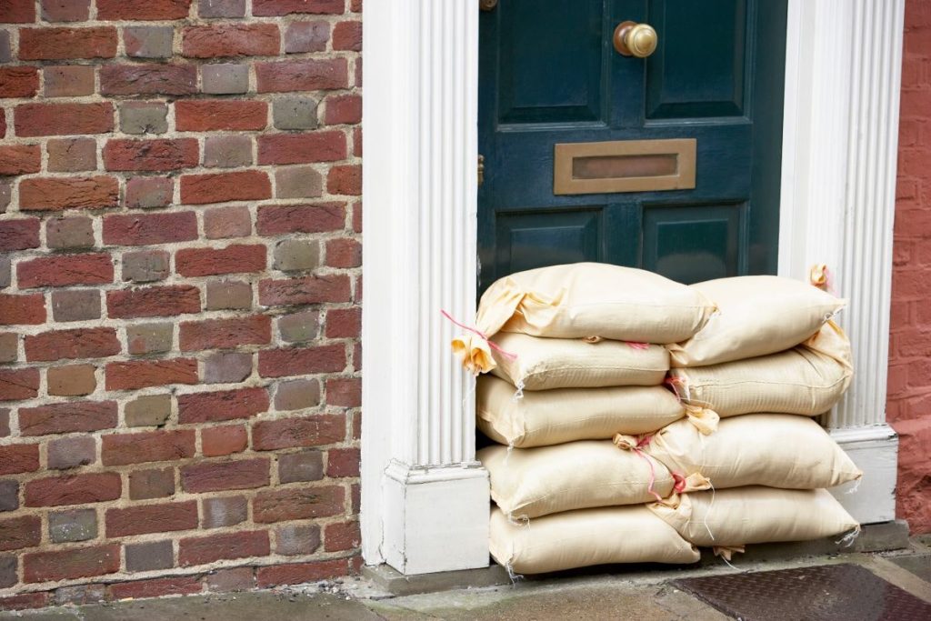bags with sand at the entrance to the house as protection against spring floods