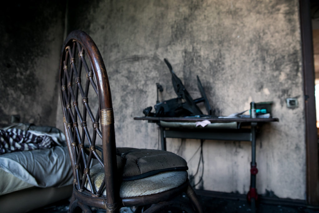 a chair and a bed after a house fire destroyed and the house needs a smoke damage repair and fire damage repair services
