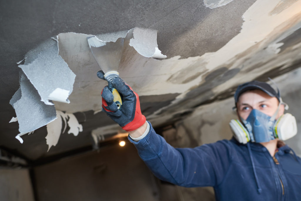 professional restoring Smoke damage ceilings and walls after house fire