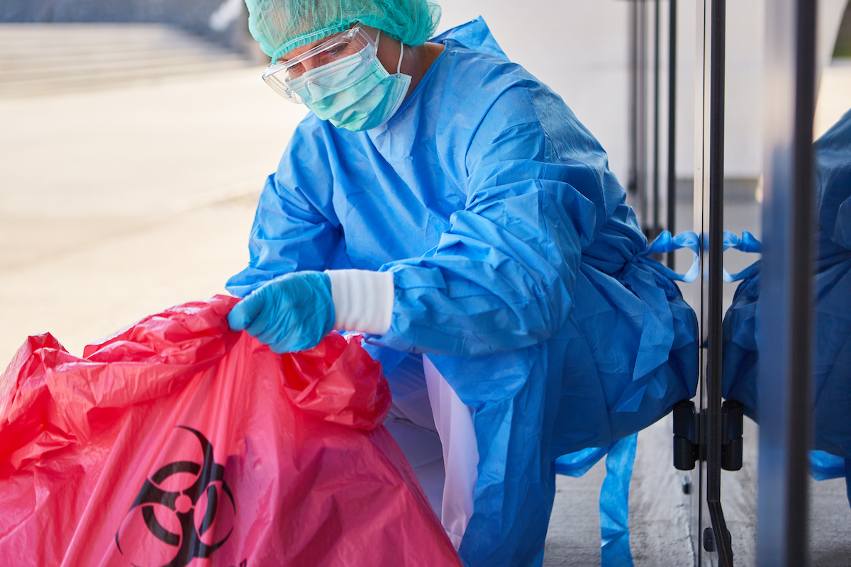 Wearing gloves while processing a crime scene