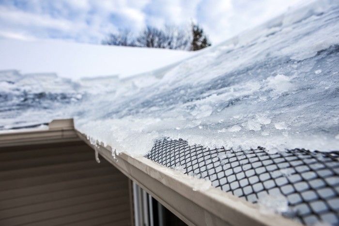 A roof with an ice dam forming on it