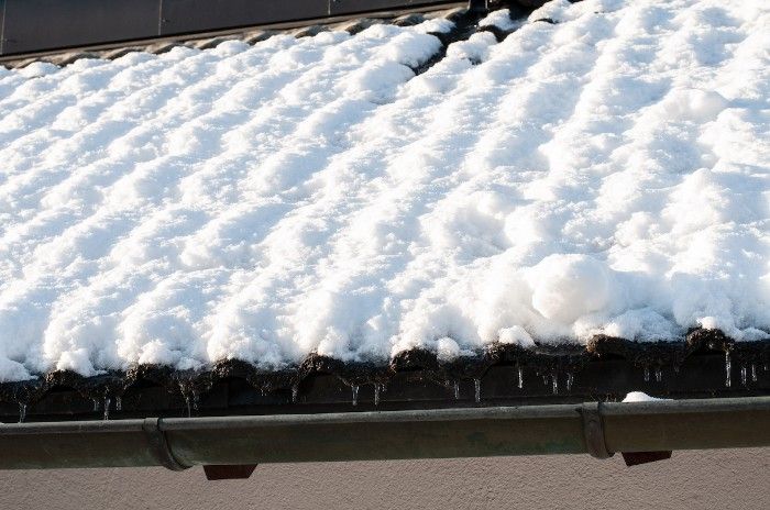 Snow laying on a roof