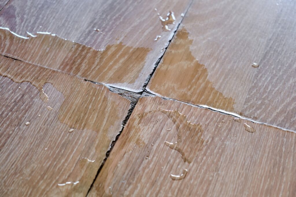 One of the signs of water damage is warping wood.